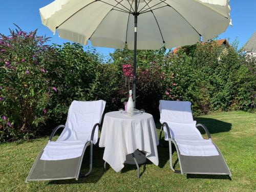 a table and two chairs and an umbrella at Residenz Royal in Gmünd