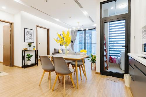 a dining room with a table and chairs at Serviced Apartment in Metropolis near Lotte and Daewoo Hanoi in Hanoi