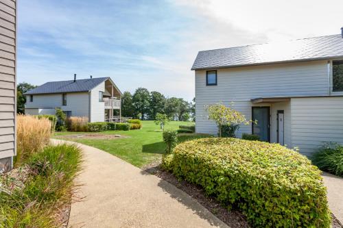 a house with a garden and a driveway at Golden Lakes Village Ardennes in Boussu-lez-Walcourt