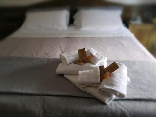 En eller flere senge i et værelse på Hotel Monte Sirai