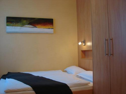 Ein Bett oder Betten in einem Zimmer der Unterkunft Rotenberg PT Hotel