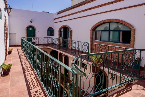 a balcony of a house with a railing at Hotel María Elena in Durango