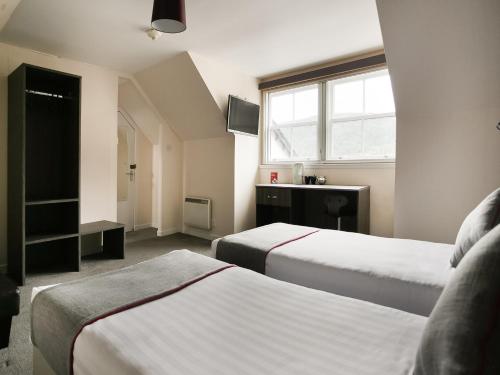 Krevet ili kreveti u jedinici u objektu The Breadalbane Arms Room Only Hotel