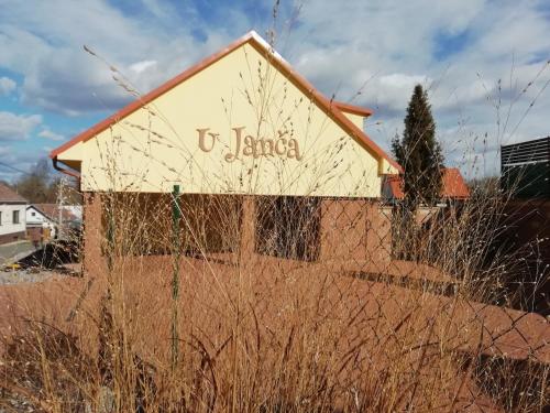 a building with the words u juana written on it at Ubytování U Janča in Lednice