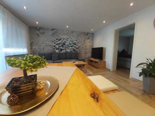 a living room with a table with a plant on it at Apartment Claudia in Sinsheim