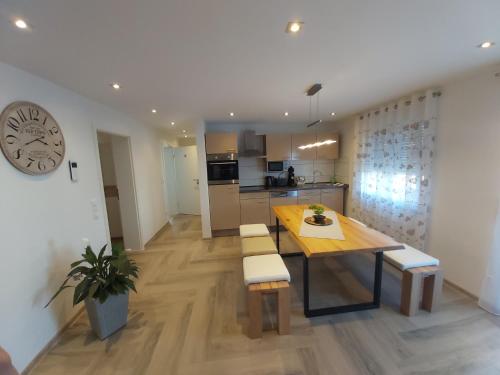 a kitchen and dining room with a table and chairs at Apartment Claudia in Sinsheim