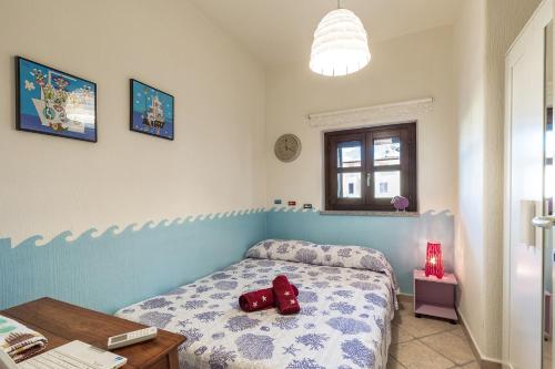 En eller flere senge i et værelse på Casa Vacanze Pedras