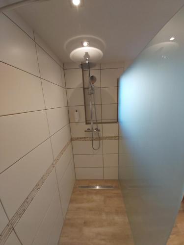 an empty room with a light on the wall at Apartment Claudia in Sinsheim