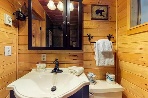 a bathroom with a sink and a toilet at Whispering Pines in Leavenworth