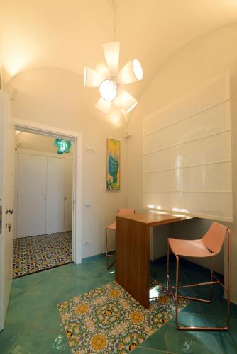 a dining room with a table and two chairs at Capri beach relais Oltremare in Capri