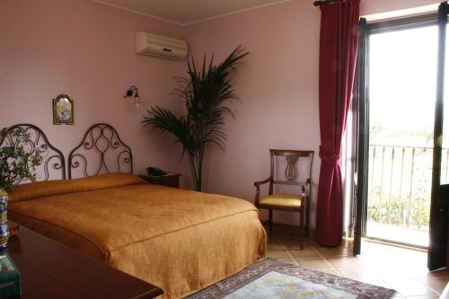 Ένα ή περισσότερα κρεβάτια σε δωμάτιο στο Don Giovanni Hotel