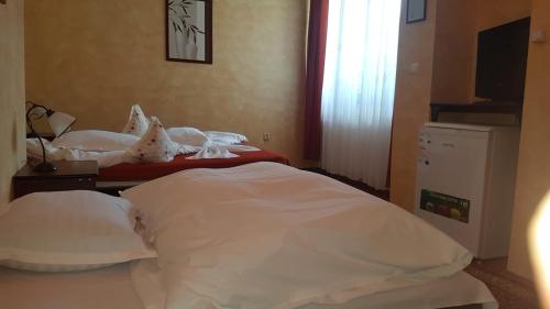 Cama ou camas em um quarto em Complex Cabana Ciucas