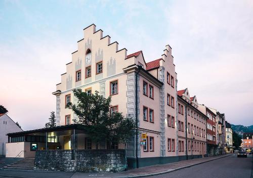 a building on the side of a street at Central City Hotel in Füssen