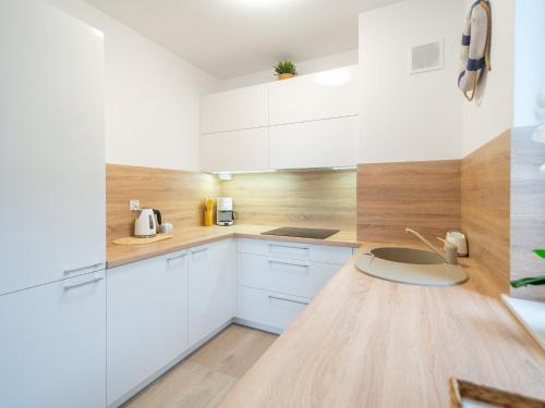 Kuchyňa alebo kuchynka v ubytovaní Apartament Happy Time SPA - Kołobrzeg