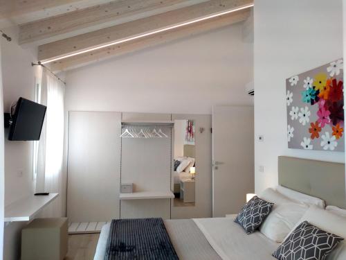 Postel nebo postele na pokoji v ubytování Le Mandragole B&B