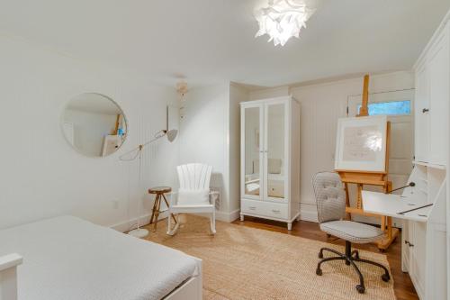 a white room with a desk and two chairs at South Hampton House in Tolovana Park
