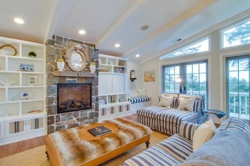 a living room with two couches and a fireplace at South Hampton House in Tolovana Park