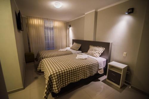 Ένα ή περισσότερα κρεβάτια σε δωμάτιο στο Hostal Montalvo