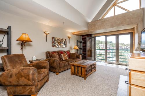 a living room with a couch and chairs and a table at Shoshone 1986 in Big Sky