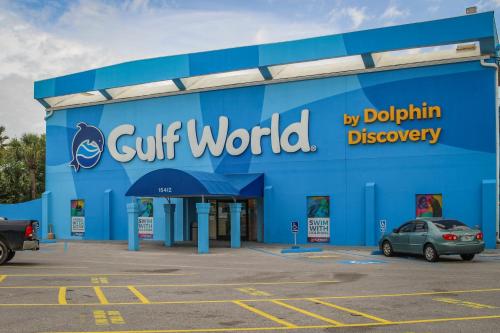 a blue building with a gift world sign on it at The Top of the Gulf #612 in Panama City Beach