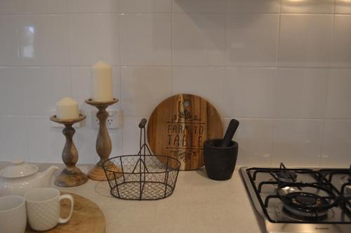 a kitchen counter with two candles and a cutting board at Gone to Barossa in Tanunda