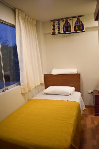 Ένα ή περισσότερα κρεβάτια σε δωμάτιο στο Casablanca Lima