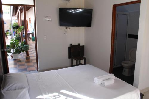 Postel nebo postele na pokoji v ubytování Hotel La Ceiba