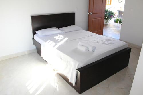 Postel nebo postele na pokoji v ubytování Hotel La Ceiba