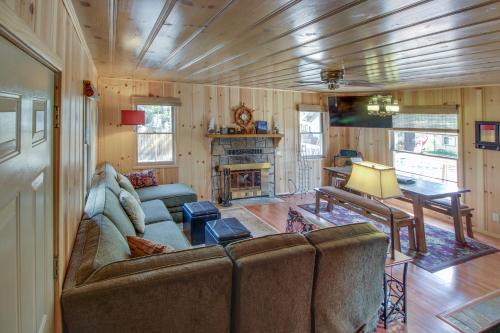 a living room with a couch and a fireplace at Cozy Bobby Grey Manor in South Lake Tahoe