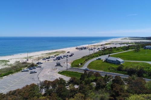 an aerial view of a parking lot next to the beach at Nauset Beach Dream in Orleans