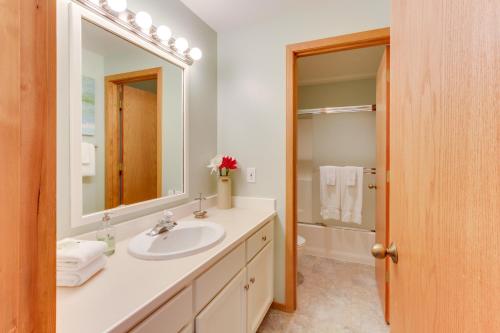 a bathroom with a sink and a mirror at Fairway Village 28 | Discover Sunriver in Sunriver