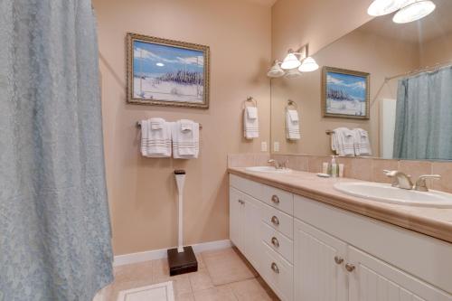 a bathroom with a sink and a mirror at Surf's Edge in Rockaway Beach