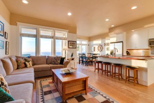 a living room and kitchen with a couch and a table at Surf's Edge in Rockaway Beach