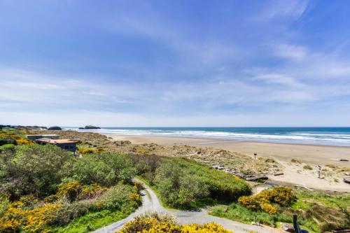 a view of a beach and the ocean at Spindrift Oceanfront Home in Bandon