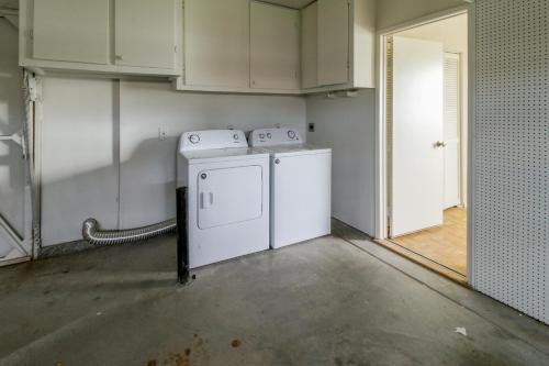 a laundry room with two washer and dryer at Buttercup Delight Permit# 106,312 in Bermuda Dunes