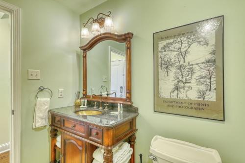 a bathroom with a sink and a mirror at Savannah Serendipity in Savannah