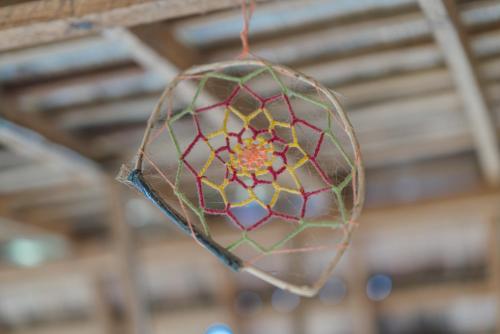 a glass ball hanging from a ceiling at Pan's Place in Vang Vieng