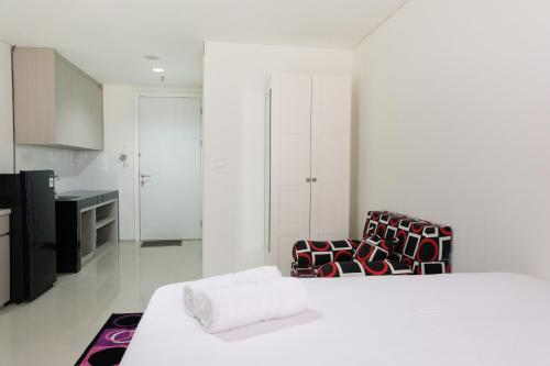 Ένα ή περισσότερα κρεβάτια σε δωμάτιο στο Modern City View Studio Apartment at Tuscany Residences By Travelio