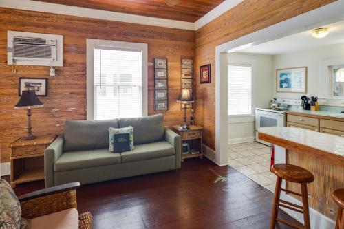 a living room with a couch and a kitchen at Windward Isle in Key West