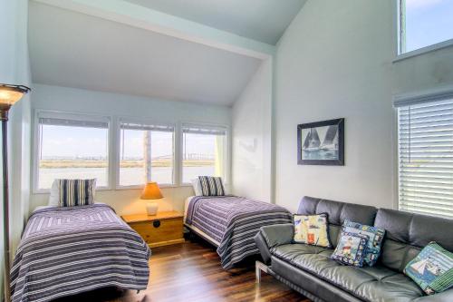 a living room with two beds and a couch at Puente Vista 119 in Padre Island