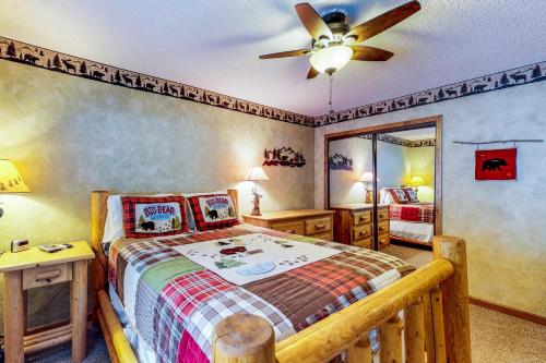 a bedroom with a bed and a ceiling fan at Saxon Creek in Mevers
