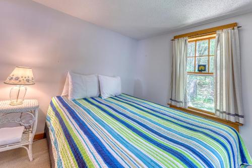 a bedroom with a bed and a window at 30 Pauli Point Road in Freedom