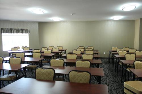 an empty classroom with tables and chairs in it at Quality Inn Southampton in Southampton