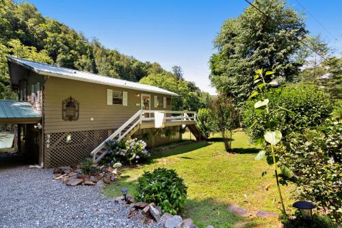 a small house with a porch and a yard at 2 Bed 1 Bath Vacation home in Sylva in Sylva