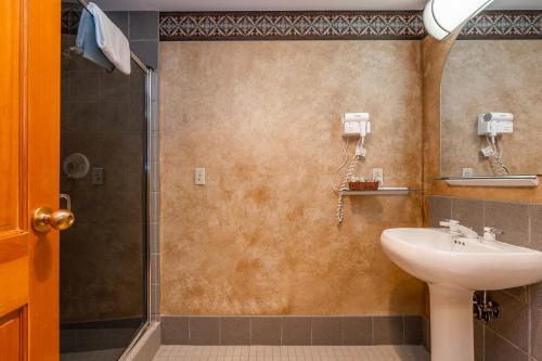 a bathroom with a sink and a shower at Shoshone 1960 in Big Sky