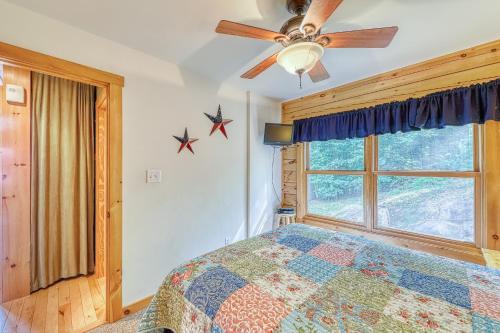 a bedroom with a bed and a window at Contemporary ADK 5 Bedroom Chalet on Schroon in Schroon Lake