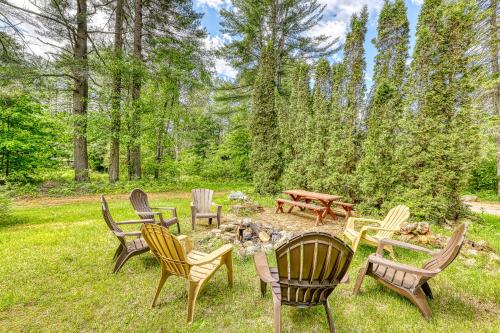 a group of chairs and a fire pit in a yard at Pine's Way Camp in Chestertown