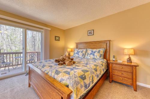 a bedroom with a teddy bear sitting on a bed at 116 Red Ridge Lane in Conway