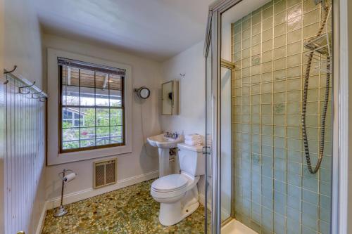 a bathroom with a toilet and a glass shower at 195 Wilmot Road in Ocean Beach