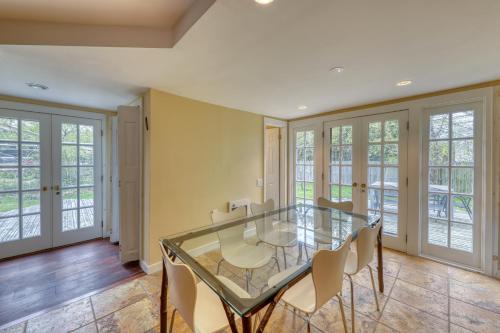 a dining room with a glass table and chairs at 195 Wilmot Road in Ocean Beach